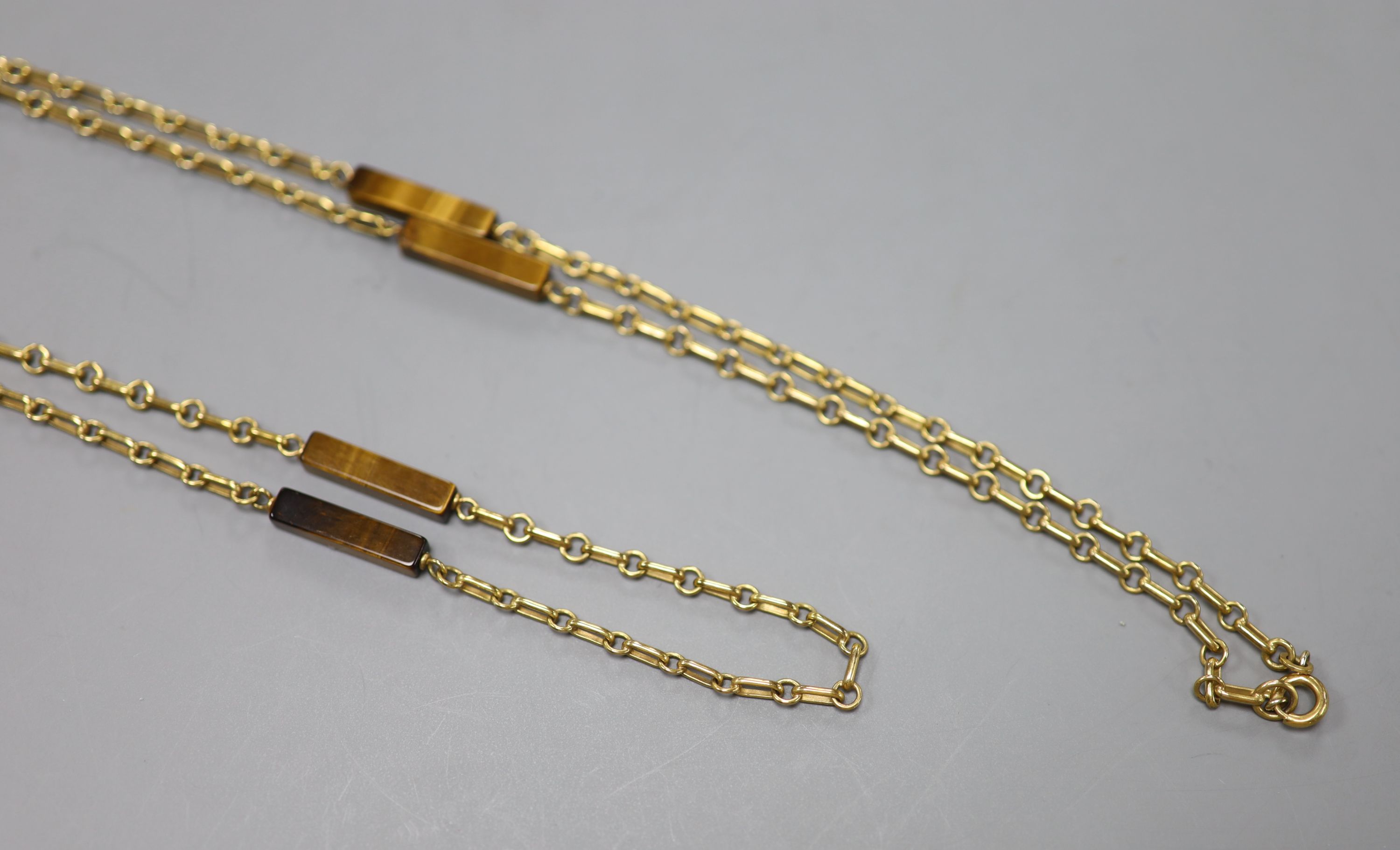 A modern 9ct gold and rectangular tiger's eye quartz baton link necklace, 79cm